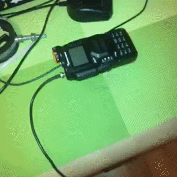 Corded Cell Phone on Green Table