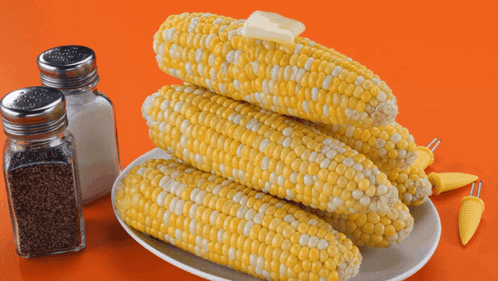 Corn On The Cob With Butter On Top Of It GIF