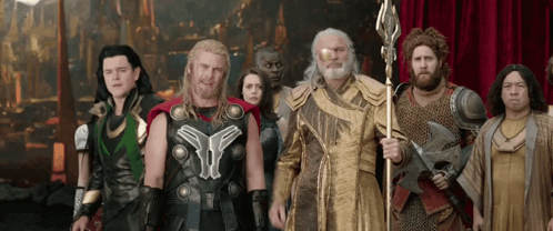 Costumed Group Standing Together GIF