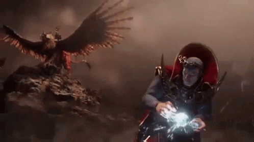 Costumed Person Before Full Moon GIF
