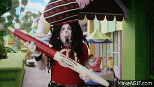 Costumed Person Holding Red White Pen With Letter A