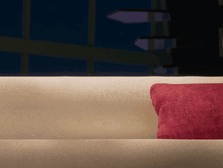 Couch With Red Pillow In Dark Room GIF