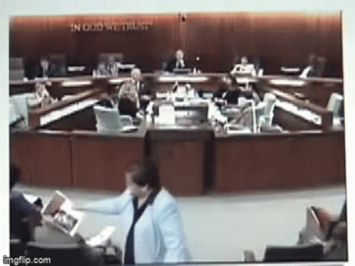 Council Meeting With In God We Trust Behind Them GIF