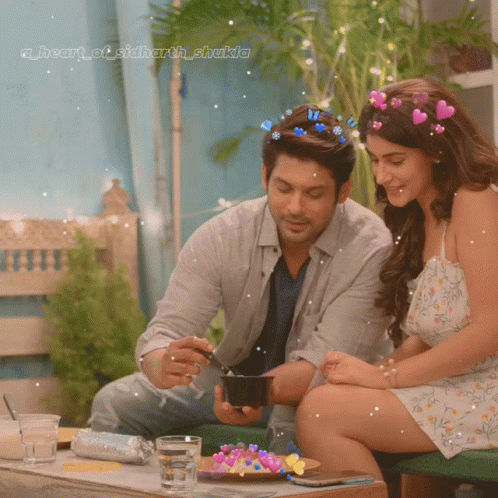 Couple at Table with Heart of Sidharth Shakila