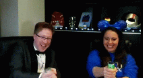 Couple Blow The Confetti Cannon GIF