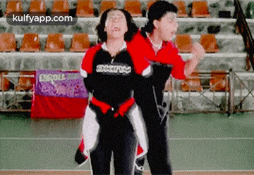 Couple Dancing in Stadium With Enroll Sign