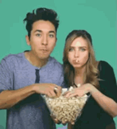 Couple Feeding Each Other Popcorn Meme GIF