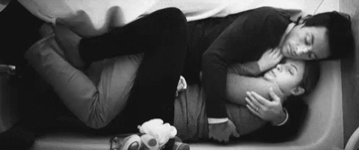 Couple Hold In The Sofa GIF