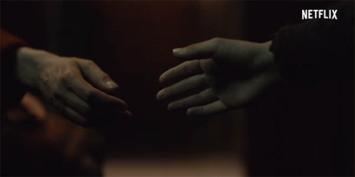 Couple Holding Hands With Netflix Logo GIF