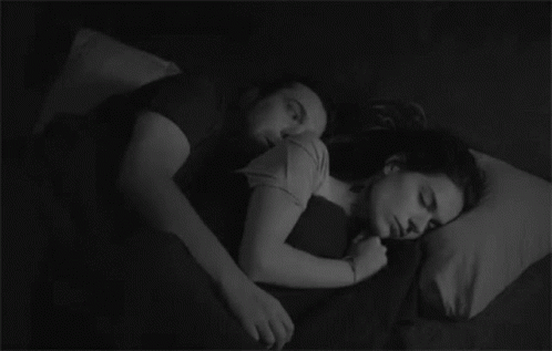 Couple Hugging in Bed