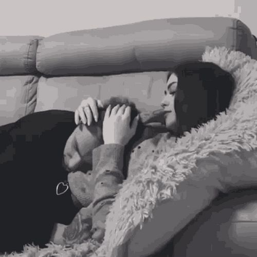 Couple Hugging In The Couch GIF