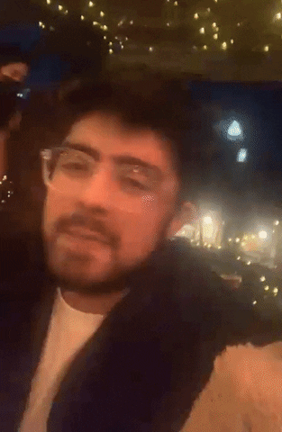 Couple In A Date Wave And Smile GIF