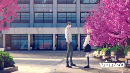 Couple in Front of Building with Vimeo Logo
