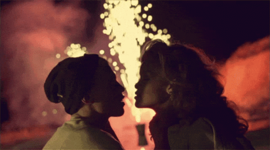Couple Kiss With Fireworks GIF
