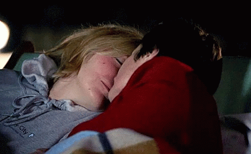 Couple Kissing In Car At Night Wearing City Sweatshirt GIF