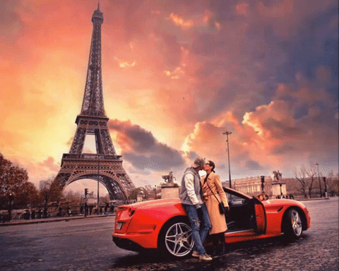 Couple Kissing In Front Of Eiffel Tower GIF