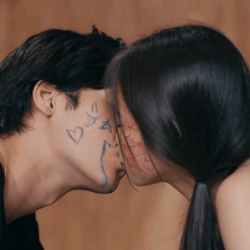 Couple Kissing With Heart On Man's Face GIF