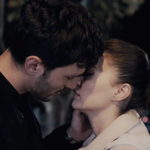 Couple Kissing Woman Touching Man's Face GIF
