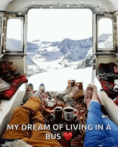Couple Laying in Back of Bus with My Dream of Living in a Bus