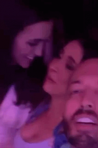 Couple Lying On Each Other In Purple Room GIF