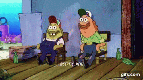 Couple Of Cartoon Characters Sitting On Wooden Floor GIF
