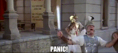 Couple Of People In Front Of Building With Panic GIF