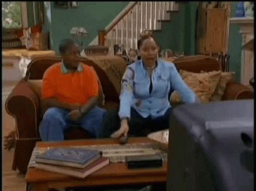 Couple On Couch With Woman Dancing GIF
