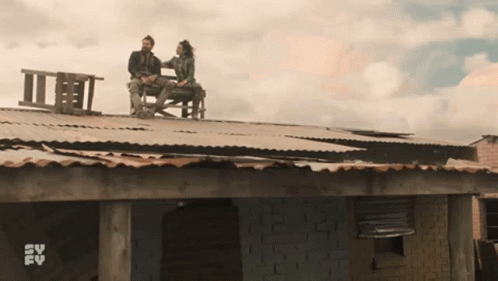 Couple on Roof With SV FV Logo Behind
