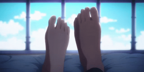 Couple's Feet in Front of Window