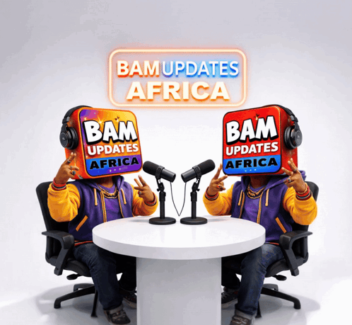 Couple Sitting at Table With Bam Updates Africa Sign