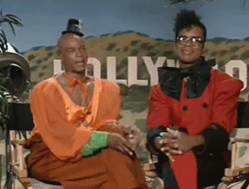 Couple Sitting In Front Of Hollywood Sign GIF