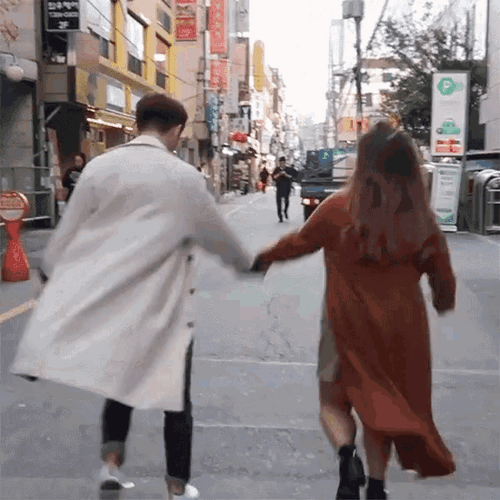 Couple Skipping In Street GIF