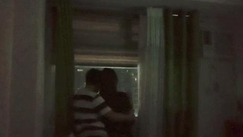Couple Standing In Front Of Green Curtain GIF