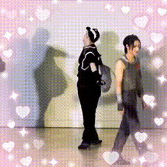 Couple Standing Together Surrounded by Hearts