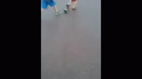 Couple Walking Down Street in Rain