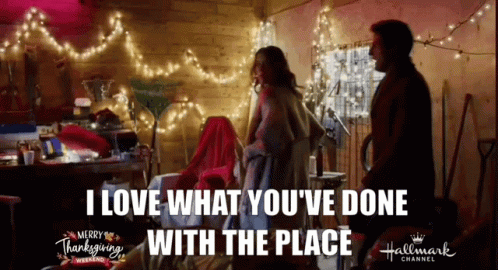 Couple With Christmas Lights Merry Thanksgiving Sign GIF