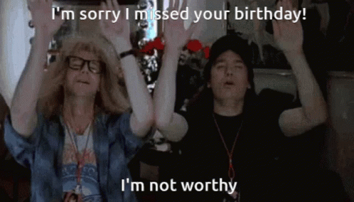 Couple With Hands Up Saying I'm Sorry I Missed Your Birthday