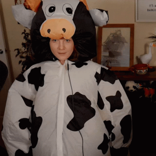 Cow Costume Woman With It's A Badge Sign GIF