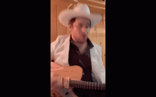 Cowboy Hat Man Guitar Singing With Yodeling Boy