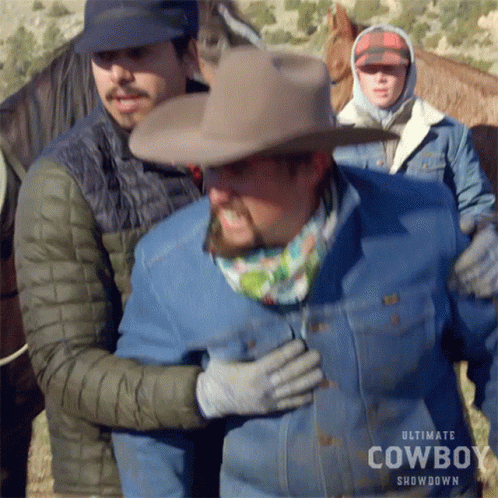 Cowboy Hat Man Held By Showdown Jacket Man GIF