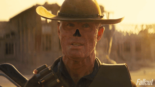 Cowboy Hat Man Holding Gun Fallout GIF