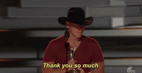 Cowboy Hat Man Holding Trophy Saying Thank You GIF