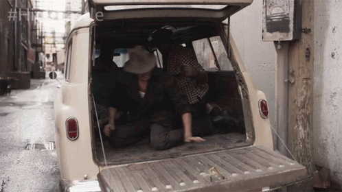 Cowboy Hat Man Kneeling in Back of Car Hashtag Historyle