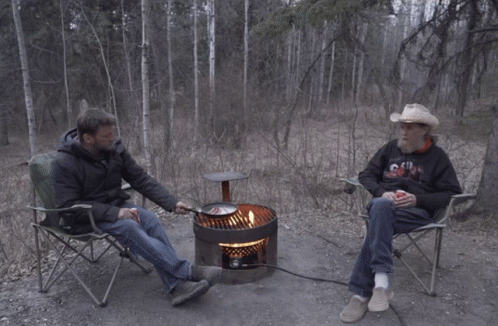 Cowboy Hat Man Next To Man In Chill Hoodie GIF