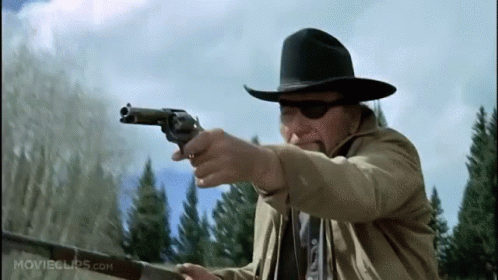 Cowboy Hat Man Pointing Gun movieclips.com