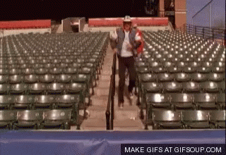 Cowboy Hat Man Walking Down Stadium Stairs