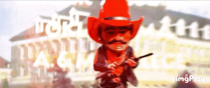 Cowboy In Red Hat Holding Gun GIF
