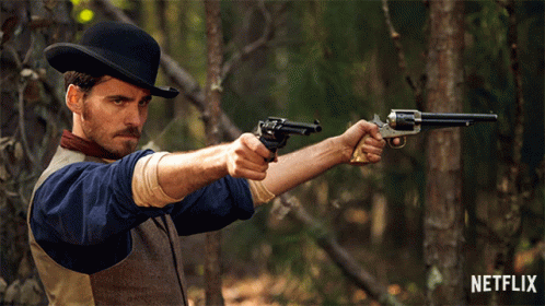 Cowboy Man Holding Guns