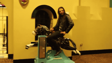 Cowboy Riding Mechanical Horse GIF