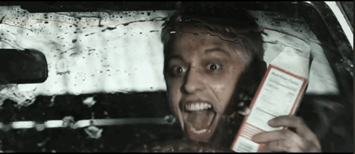 Crazy Driver Holding Box Of Milk GIF